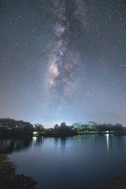 istock beautiful night sky by the river 1057002650