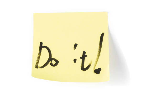 istock Post-it note with handwritten message in black marker pen reading Do it !. 1057005260