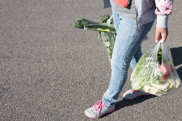 istock Woman holding a plastic bag 1057005714