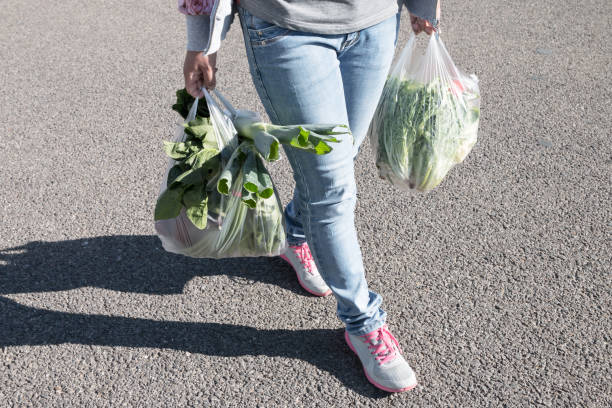 istock Woman holding a plastic bag 1057005786