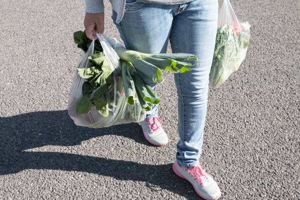 istock Woman holding a plastic bag 1057006880