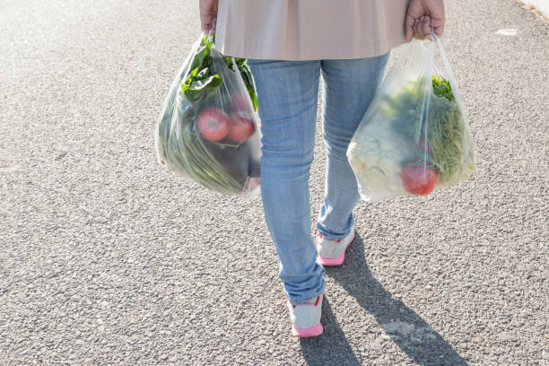 istock Woman holding a plastic bag 1057009304