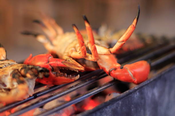 istock Grilled crab on iron curtain in the fireplace. 1057009382