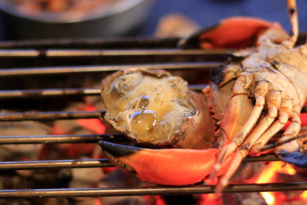 istock Grilled crab on iron curtain in the fireplace. 1057009422