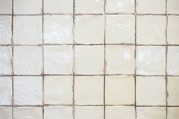 istock white old dirty tile wall in the bathroom, did not clean yet. 1057009442