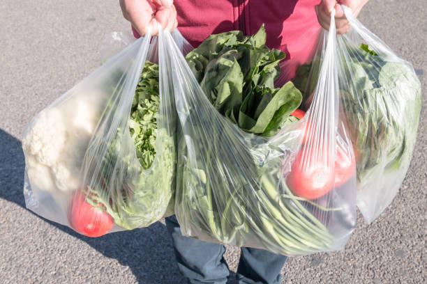 istock Male holding a plastic bag 1057009456
