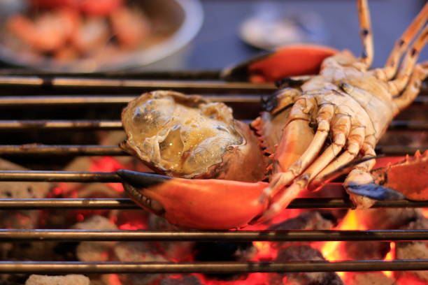 istock Grilled crab on iron curtain in the fireplace. 1057009718
