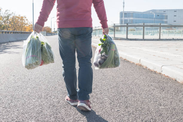 istock Male holding a plastic bag 1057012192