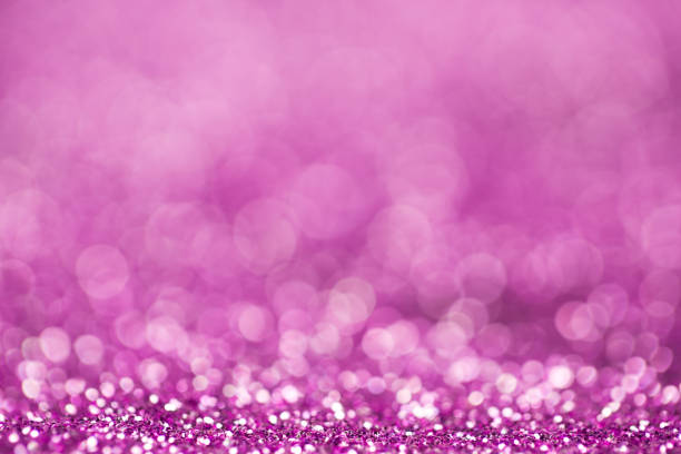 istock Blurry background, purple glitter sparkles 1057014822
