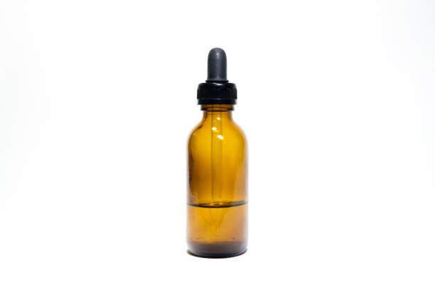 istock Amber bottle containing liquid for laboratory in isolation 1057030622