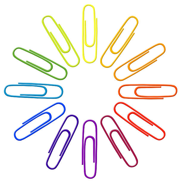 Rainbow paper clips on a white background stock photo