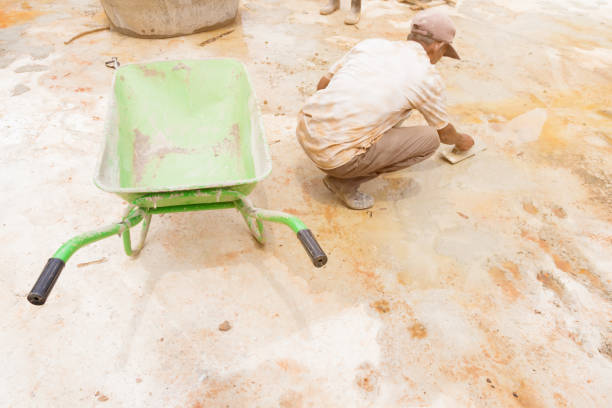 istock construction workers were plastering repair floor in workplace build a house with copy space add text 1057042498