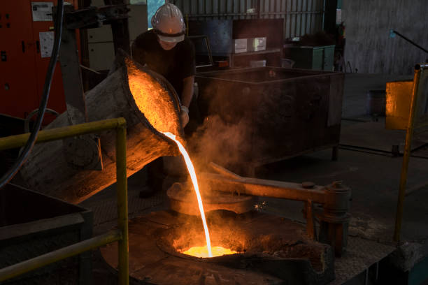 istock Molten iron pour from ladle into melting furnace 1057042726