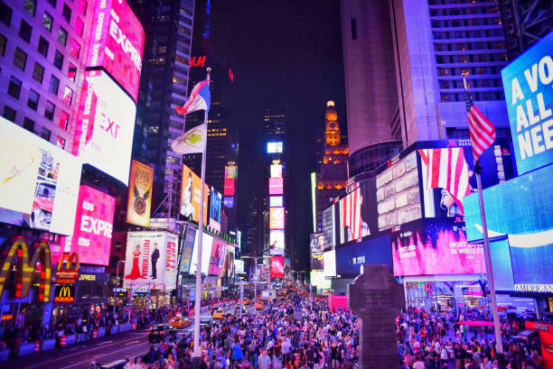 istock Lights and people, the typical stamp in Times Square at night 1057048456