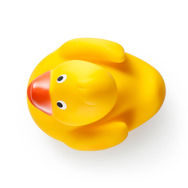 yellow rubber duck on white background. photo with clipping path. - duck toy imagens e fotografias de stock