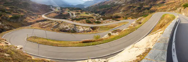 Photo of Road to the San Bernardino mountain pass in Switzerland.  View of the mountain bends creating beautiful shapes