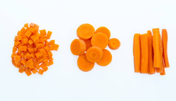 karotte in verschiedene formen geschnitten - carrot isolated white carotene stock-fotos und bilder