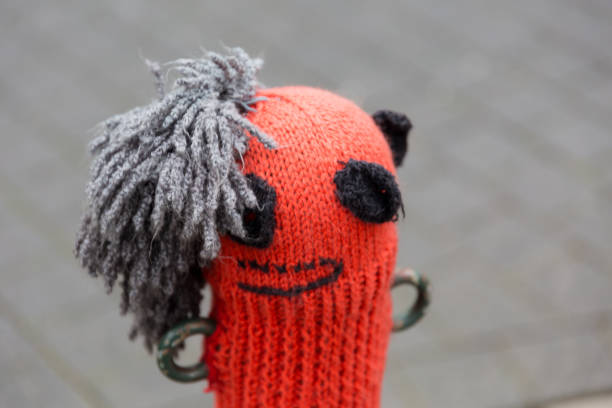 istock Woolen hat on a street pole 1057058216