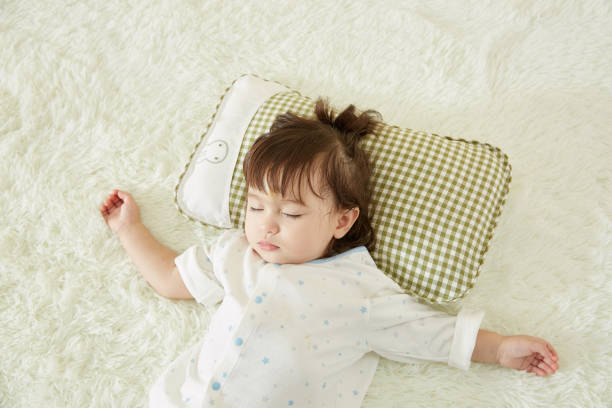 istock Cute little girl sleeping in bed 1057062740