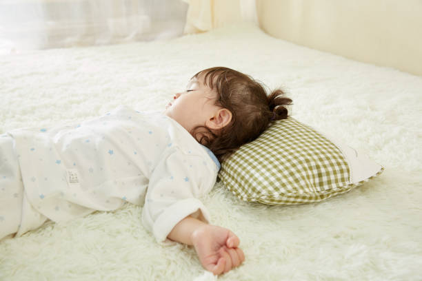 istock Cute little girl sleeping in bed 1057062938