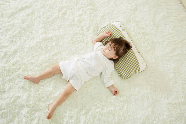 istock Cute little girl sleeping in bed 1057063016