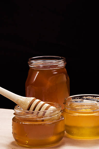 istock glass pot of honey 105706511