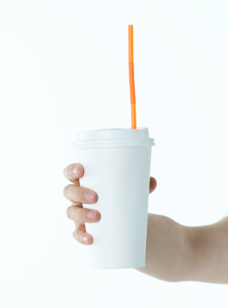 istock Woman hand holding a white disposable cup 1057065392