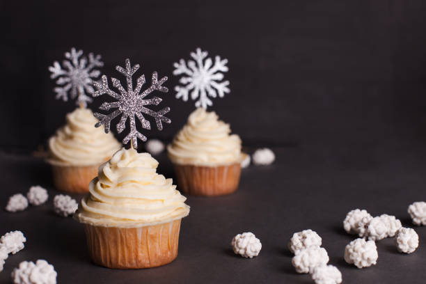 istock Christmas cupcake decorated with shining snowflakes 1057065394