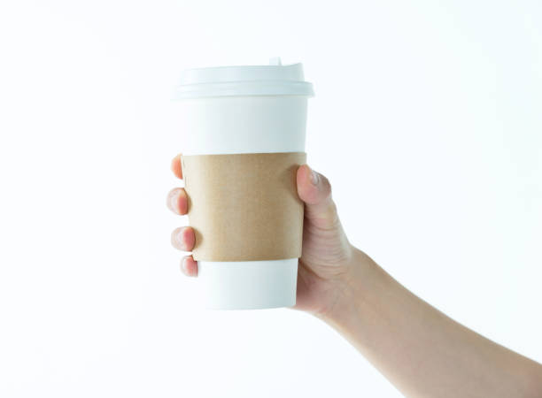 istock Woman hand holding a coffee cup 1057065404