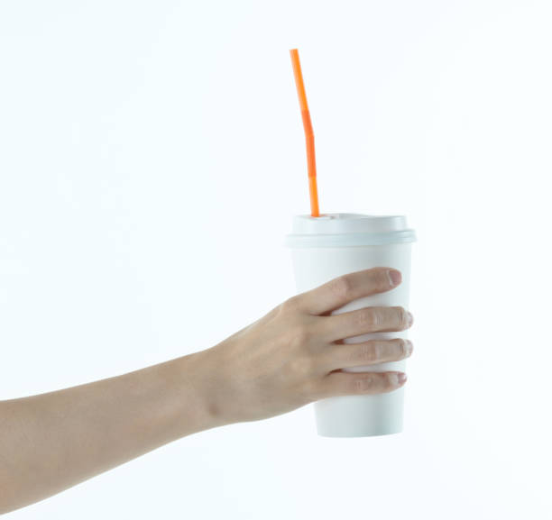 istock Woman hand holding a white disposable cup 1057066410