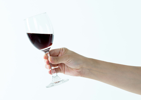 Woman hand holding a glass of wine.