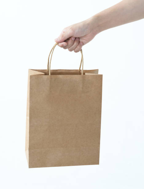 istock Woman hand holding shopping bag 1057066668