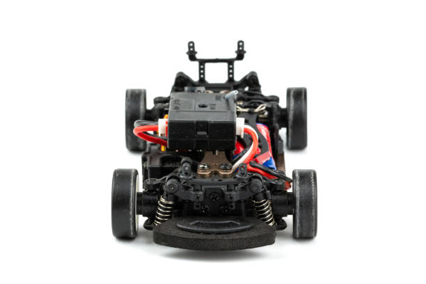 istock Front view of RC drift car (Radio-controlled) without body isolated on white background. (This toy has some dust from children playing) 1057067472