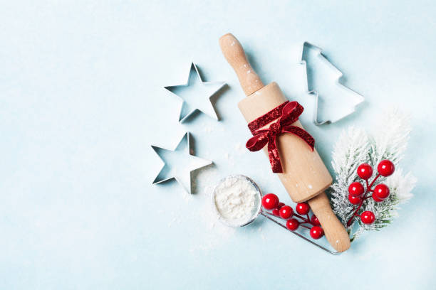 istock Bakery background for cooking christmas baking with rolling pin and scattered flour with fir tree top view. 1057068038