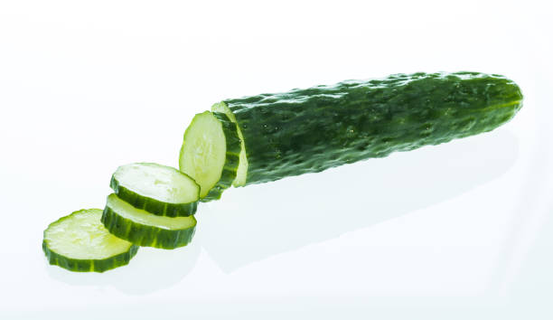 istock Fresh cucumber slices on white background 1057069526