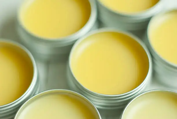 natural lip balms from beeswax in tin pots