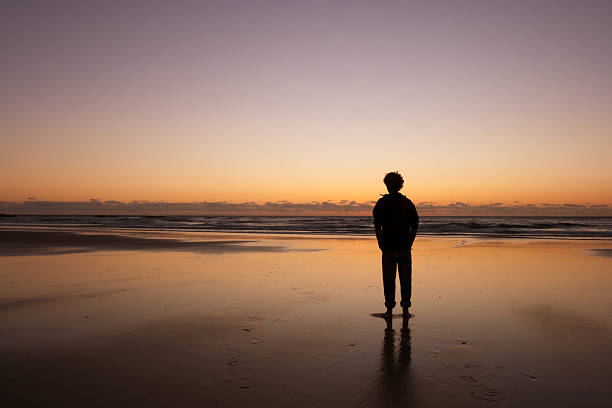 istock Man Waiting and Sunrise on the Beach, Australia 105707538