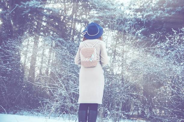 istock Woman walking in winter in the forest. 1057082188