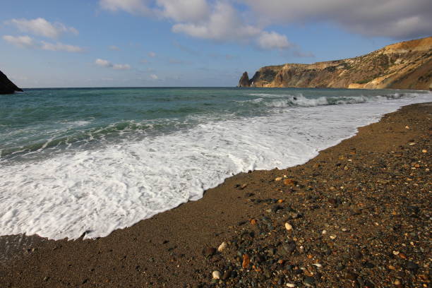 istock sea wave crashing against rocks 1057082846