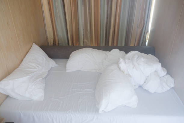 istock Close-up of unfinished or messy bed after funny night 1057084626