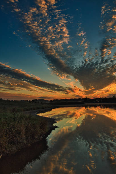 istock Sunrise with clouds on the lake 1057085158