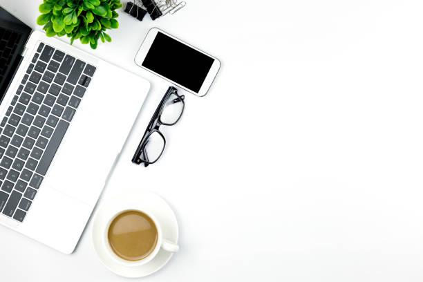 istock Workspace in office ,White desk with blank notebook and other office supplies,Top view with copy space. 1057085338