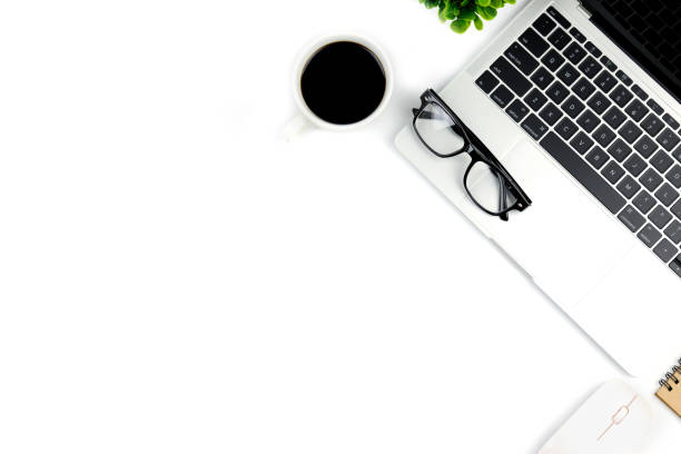 istock Workspace in office ,White desk with blank notebook and other office supplies,Top view with copy space. 1057085450