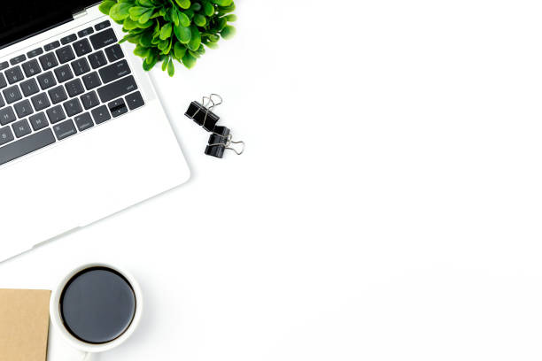 istock Top view of Office desk with workspace in office with blank notebook and other office supplies,with copy space. 1057085476