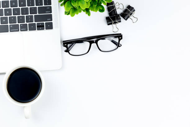 istock Workspace in office ,White desk with blank notebook and other office supplies,Top view with copy space. 1057085638