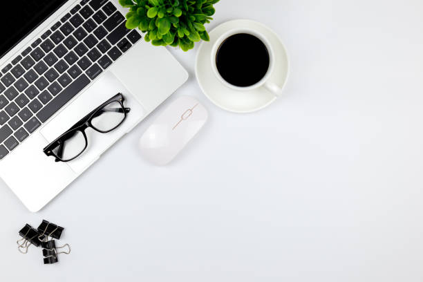 istock Top view of Office desk with workspace in office with blank notebook and other office supplies,with copy space. 1057085918