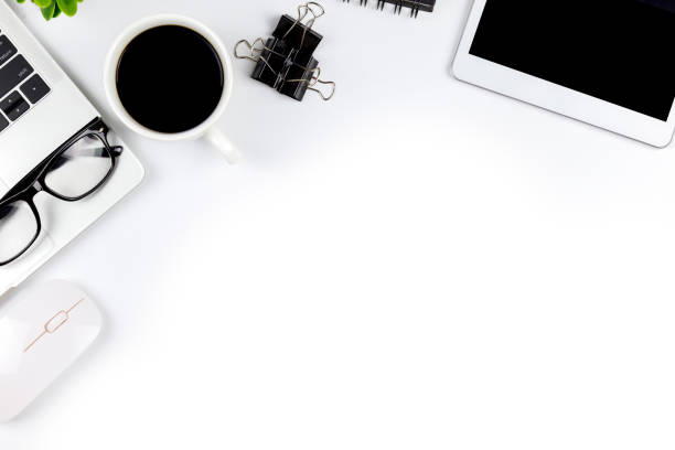 istock Top view of Office desk with workspace in office with blank notebook tablet and smartphone with other office supplies,with copy space. 1057087844