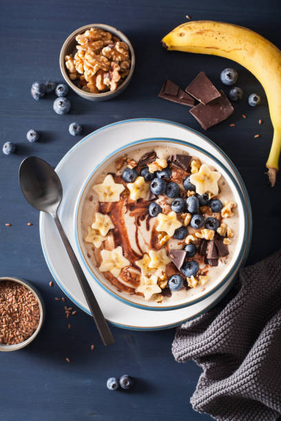 istock healthy banana smoothie bowl with blueberry chocolate walnuts 1057090234