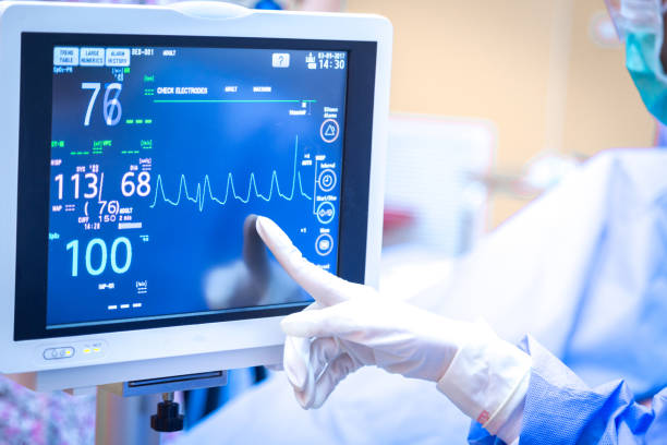istock Female surgeon using monitor in operating room. 1057098040