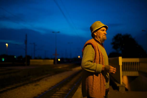 istock old man on old job walking by train station 1057099518